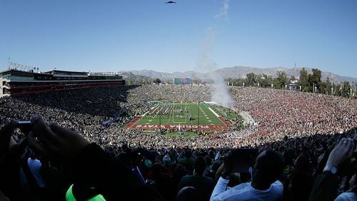 In this photo taken with a fisheye lens, a U.S. Air Force B-2 stealth bomber does a flyover before the Rose Bowl NCAA college football playoff semifinal between Oregon and Florida State, Thursday, Jan. 1, 2015, in Pasadena, Calif. (AP Photo/Richard Vogel)