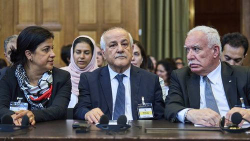 Palestinian foreign policy advisor Riad Malki and other members of the legal team take their seats before judges enter the International Court of Justice, or World Court, in The Hague, Netherlands, Friday July 19, 2024, where the United Nations top court is delivering a nonbinding advisory opinion Friday on the legality of Israel's 57-year occupation of lands sought for a Palestinian state, a ruling that could have more effect on international opinion than it will on Israeli policies. (AP Photo/Phil Nijhuis)