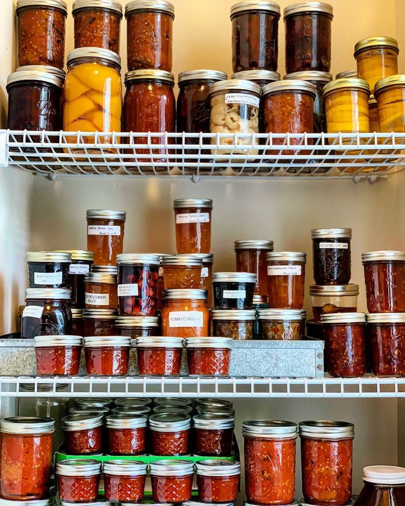 Chef and food writer Asha Gomez has a love for preserving food. Pictured here are some of the canned goods in her pantry. CONTRIBUTED BY ASHA GOMEZ