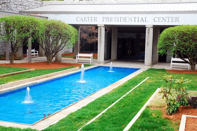 A reflective pool  in front of the Jimmy Carter Presidential Library and Museum in Atlanta. A number of events are planned to mark the former president's 100th birthday later this year. Some of the events are scheduled in Carter's hometown of Plains and in Atlanta, including at the presidential library. (James Kirkikis/Dreamstime/TNS)