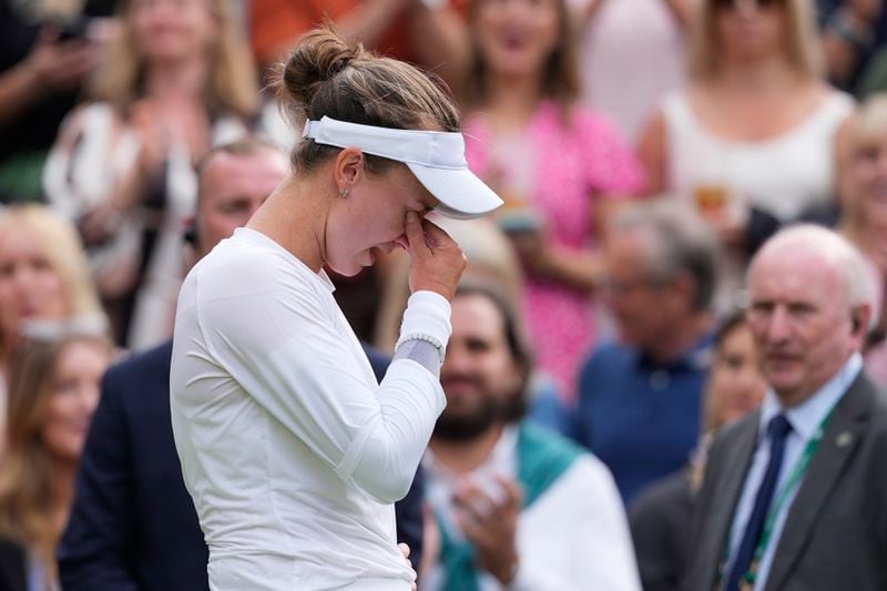 Barbora Krejcikova of the Czech Republic reacts after defeating Elena Rybakina of Kazakhstan in their semifinal match at the Wimbledon tennis championships in London, Thursday, July 11, 2024. (AP Photo/Alberto Pezzali)