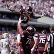 Texas A&M running back Le'Veon Moss (8) celebrates with teammate Chase Bisontis (71) after he scored a touchdown against Missouri during the first half of an NCAA college football game Saturday, Oct. 5, 2024, in College Station, Texas. (AP Photo/Eric Gay)