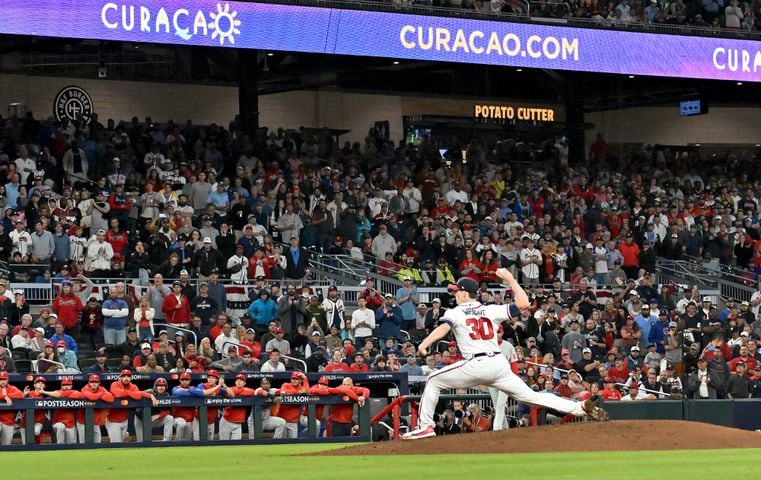 Atlanta Braves starting pitcher Kyle Wright (30) delivers to the Philadelphia Phillies during the sixth inning of game two of the National League Division Series at Truist Park in Atlanta on Wednesday, October 12, 2022. (Hyosub Shin / Hyosub.Shin@ajc.com)