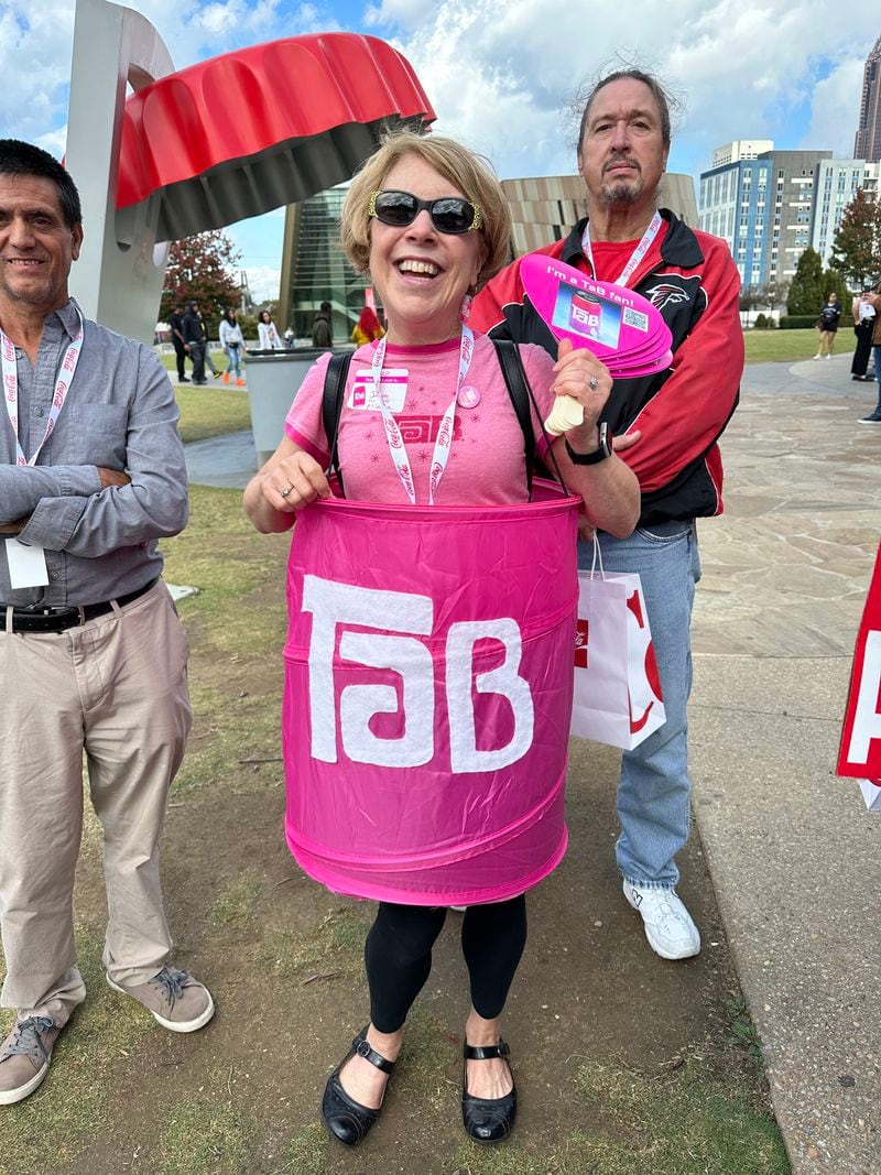Jenny Boyter, a retired school administrator from Buckhead, wears a TaB outfit at a "Save TaB" gathering outside the World of Coke on Oct. 20, 2023. RODNEY HO/rho@ajc.com
