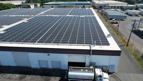 Solar arrays on top of a warehouse in Pennsauken, New Jersey, on June 13, 2024. The array was built by Solar Landscapes. The company installs solar as part of New Jersey's community solar program, in which the arrays create power that can be bought by people living nearby. (Jenna Miller/The Philadelphia Inquirer/TNS)