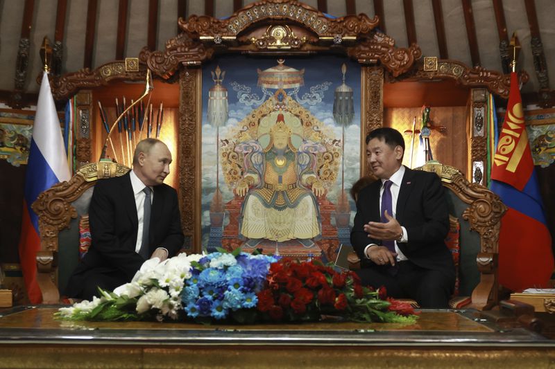 Russian President Vladimir Putin, left, and Mongolian President Ukhnaagiin Khurelsukh attend a meeting at the Saaral Ordon Government Building in Ulaanbaatar, Mongolia, Tuesday, Sept. 3, 2024. (Vyacheslav Prokofyev, Sputnik, Kremlin Pool Photo via AP)