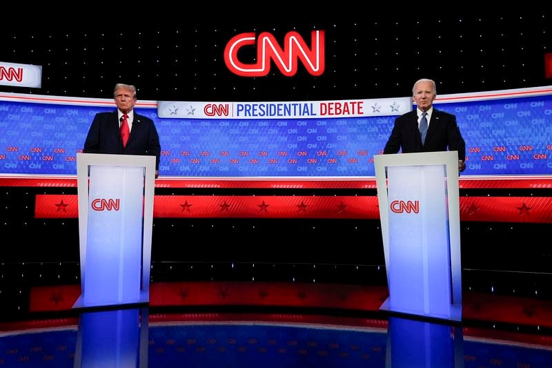 FILE - President Joe Biden, right, and Republican presidential candidate former President Donald Trump, left, stand during break in a presidential debate hosted by CNN, Thursday, June 27, 2024, in Atlanta. There were exhaustive, independent fact-checks of claims made during the debate but none available to the millions of people watching the two presidents in real time. (AP Photo/John Bazemore, File)