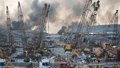 FILE - Smoke rises after a massive explosion at the port in Beirut, on Aug. 4, 2020. (AP Photo/Hassan Ammar, File)