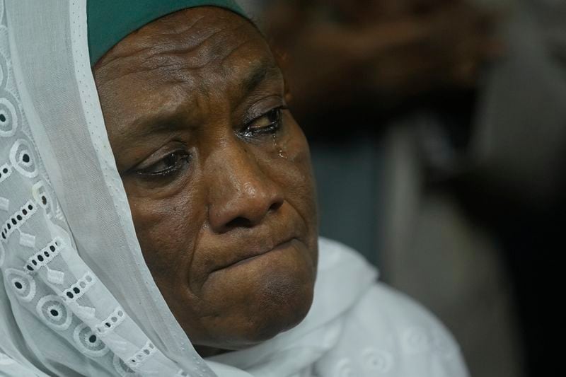 Sarah Naqd Allah, from Sudan's main opposition Umma Party, cries as she watches Camirata troupe traditional show at the Russian culture center in Cairo, Egypt, Sunday, Sept. 15, 2024. (AP Photo/Amr Nabil)