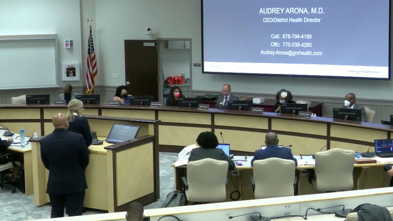 Dr. Audrey Arona, director of the Gwinnett, Newton and Rockdale health departments, briefed the Gwinnett County school board about recent COVID-19 trends on Thursday, July 21, 2022. The district enacted a temporary mask requirement for staff based on CDC guidelines. After months of mostly not wearing masks, staff at the meeting and most of the board resumed wearing a mask.