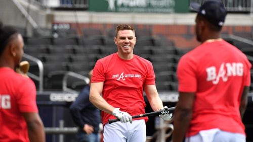 October 6, 2021 Atlanta -  Atlanta Braves first baseman Freddie Freeman smiles after taking batting practice during a workout prior to traveling to Milwaukee for the 2021 NLDS at Truist Park on Wednesday, October 6, 2021. (Hyosub Shin / Hyosub.Shin@ajc.com)