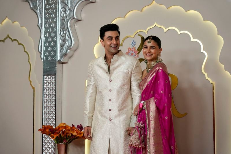 Bollywood actor couple Ranbir Kapoor and Alia Bhatt pose for a photograph at the wedding of Billionaire Mukesh Ambani's son Anant Ambani and Radhika Merchant at Jio World Convention Centre in Mumbai, India, Friday, July 12, 2024. (AP Photo /Rajanish Kakade)