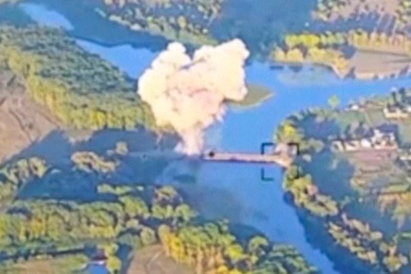 FILE - In an image taken from footage released by the Ukrainian armed forces on Aug. 18, 2024, smoke billows in what is said to show the destruction of a key bridge in Russia's Kursk region by Ukrainian forces. (Ukrainian Armed Force via AP, File)