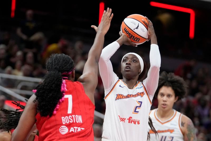 Phoenix Mercury's Kahleah Copper (2) shoots over Indiana Fever forward Aliyah Boston (7) during the first half of a WNBA basketball game, Friday, Aug. 16, 2024, in Indianapolis. (AP Photo/Darron Cummings)