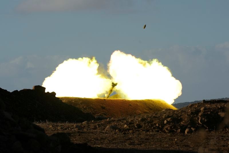 An Israeli mobile artillery unit fires a shell from northern Israel towards Lebanon, Wednesday, Oct. 2, 2024. (AP Photo/Baz Ratner)