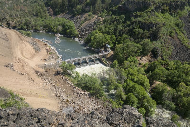 In this May 2023 image provided by Swiftwater Films shows the Klamath River and the dam known as Copco 2 in Siskiyou County, Calif. (Swiftwater Films via AP)