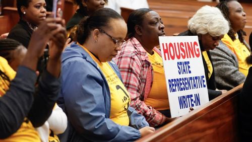 Members of We Thrive in Riverside Renters Association attend a U.S. Senate Human Rights Subcommittee Hearing to support renters as they give testimonies about living in unsuitable housing conditions on Monday, March 4, 2024. (Natrice Miller/ Natrice.miller@ajc.com)