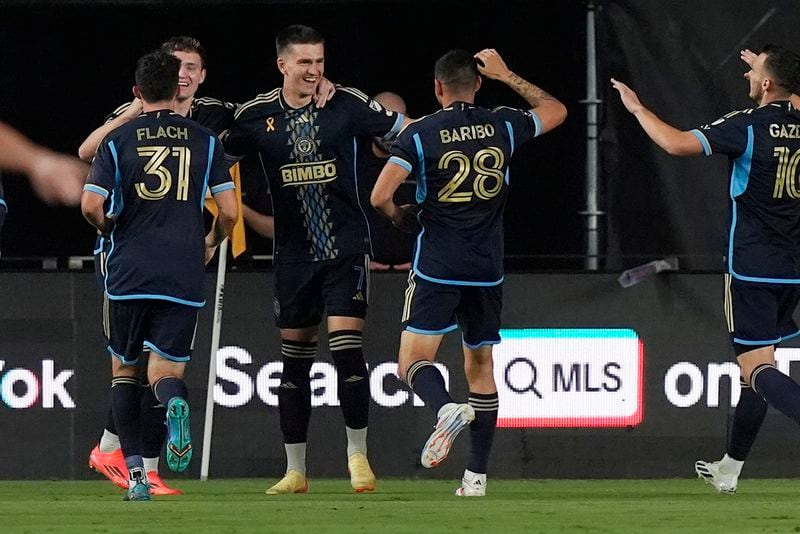 Teammates celebrate a goal by Philadelphia Union forward Mikael Uhre (7) during the first half of an MLS soccer match against the Inter Miami, Saturday, Sept. 14, 2024, in Fort Lauderdale, Fla. (AP Photo/Marta Lavandier)