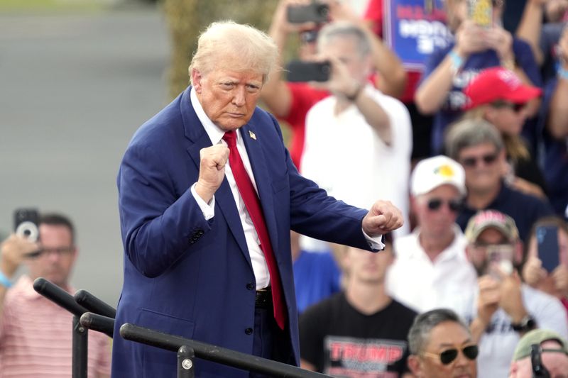 Republican presidential nominee former President Donald Trump dances during a campaign event in Asheboro, N.C., Wednesday, Aug. 21, 2024. (AP Photo/Chuck Burton)