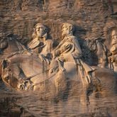 From left to right: Jeff Davis, Robert E. Lee and Stonewall Jackson carved into the side of Stone Mountain. (AJC File)
