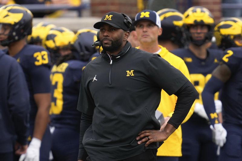 Michigan head coach Sherrone Moore watches against Texas in the second half of an NCAA college football game in Ann Arbor, Mich., Saturday, Sept. 7, 2024. (AP Photo/Paul Sancya)