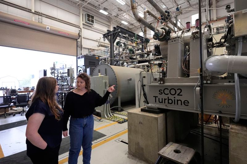 Cindy Taff, right, and Brianna Byrd, left, with Sage Geosystems, a startup that aims to make clean electricity, visit Southwest Research Institute where testing and research is taking place in San Antonio, Monday, April 1, 2024. (AP Photo/Eric Gay)