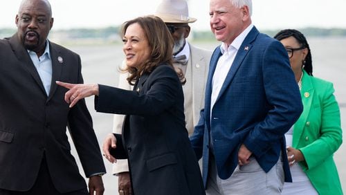 Vice President and Democratic presidential candidate Kamala Harris, second from left, and her running mate, Minnesota Gov. Tim Walz, right, arrive at Savannah/Hilton Head International Airport in Savannah, Georgia, on Aug. 28, 2024, as part of a two-day campaign bus tour. (Saul Loeb/AFP/Getty Images/TNS)