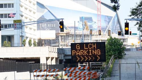 Fences surround sections of the Gulch parking lot to prevent the public from entering as Centennial Yards has begun construction on its central entertainment district, making parking unavailable across much of the 50-acre property on Monday, July 1, 2024. (Miguel Martinez/AJC)