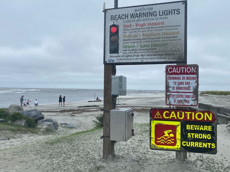 A beach warning sign flashes red on St. Simons Island on Georgia's coast on Tuesday, Aug. 6, 2024.