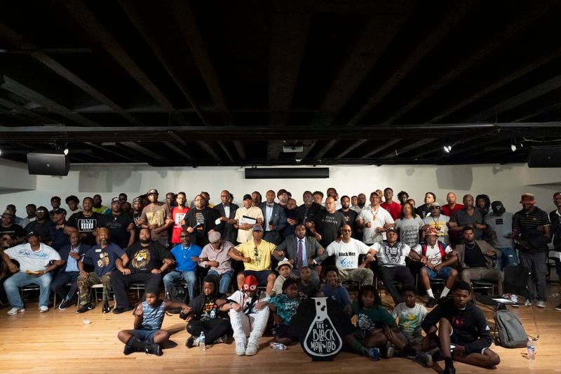 Attendees pose for photos after a Black Man Lab meeting to discuss the candidacy of Vice President Kamala Harris, Monday, July 22, 2024, in Atlanta. (AP Photo/Stephanie Scarbrough)