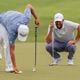 Scottie Scheffler shares a laugh with Collin Morikawa on the 18th green during the third round of the Tour Championship golf tournament, Saturday, Aug. 31, 2024, in Atlanta. (AP Photo/Jason Allen)