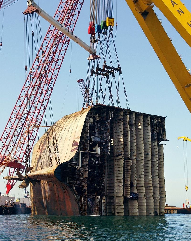 A part of the sunken Norwegian-registered tanker Tricolor was lifted out of the water as about 200 salvage experts began the delicate work of retrieving the Tricolor from the floor of the English Channel on Aug. 3, 2003. The Norwegian-owned ship, which sank in December 2002 while hauling a load of luxury cars, was chopped up into nine pieces as part of a tricky procedure to lift the vessel out of the world’s busiest sea lane. 