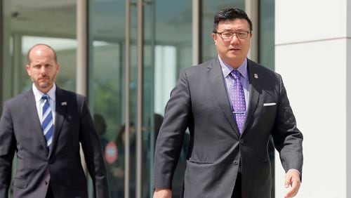 U.S. Attorney Byung J. “BJay” Pak, (right) in August, leaving the federal building to speak to the media after hearings on charges against former city of Atlanta officials. BOB ANDRES /BANDRES@AJC.COM