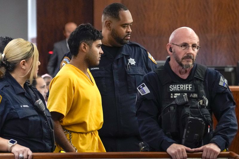 Johan Jose Rangel-Martinez is led into the courtroom on Tuesday, June 25, 2024 in Houston. Capital murder charges have been filed against Johan Jose Rangel Martinez and Franklin Jose Pena Ramos, in the strangulation death of the 12-year-old. (Brett Coomer/Houston Chronicle via AP)
