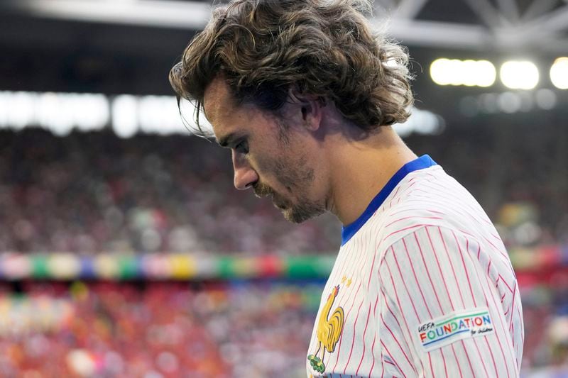 Antoine Griezmann of France walks to take a corner kick during a round of sixteen match between France and Belgium at the Euro 2024 soccer tournament in Duesseldorf, Germany, Monday, July 1, 2024. (AP Photo/Darko Vojinovic)