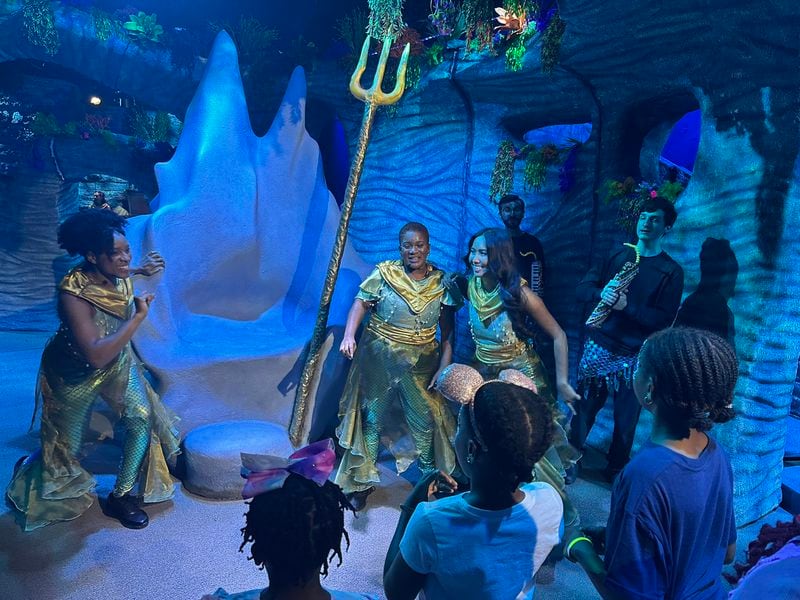 "The Little Mermaid' at the CAMP store in Dunwoody opens with a big dance and song routine at King Triton's throne. RODNEY HO/rho@ajc.com