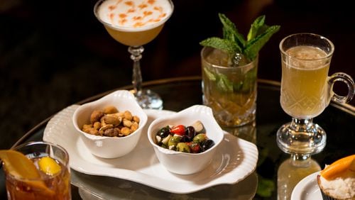 Parlor's Marinated Olives and Candied Nuts with Mr. Jones, Cuvee du Merlet, Julep a la Dabney, and Rack Punch cocktails.