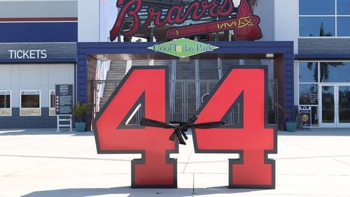 A black ribbon adorns Hank Aaron’s number 44 statue outside CoolToday Park Tuesday, Feb. 23, 2021, in North Port, Fla. The Hall of Famer died in January 2021 in Atlanta. (Curtis Compton / Curtis.Compton@ajc.com)