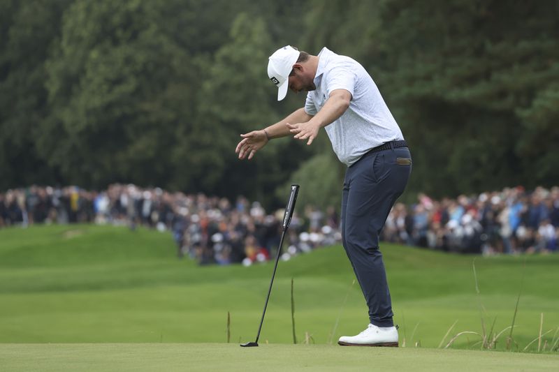 Thirston Lawrence of South Africa reacts to his putt on the 18th green during the final round of the British PGA golf Championship at Wentworth golf club in Wentworth, England, Sunday, Sept. 22, 2024. (AP Photo/Ian Walton)