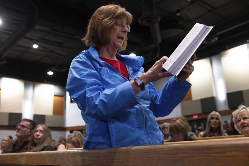 Maureen Lawlyes reads a bible verse at a Comeback California Tour event at Revival Fellowship, Saturday, Sept. 21, 2024, in Menifee, Calif. (AP Photo/Zoë Meyers)