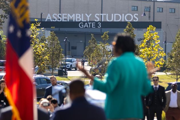 A grand opening ceremony for Veranda at Assembly, a new apartment building, takes place in Doraville on Thursday, September 19, 2024, with a view of Assembly Studios across the street. The Assembly redevelopment site was formerly a GM plant. (Arvin Temkar / AJC)