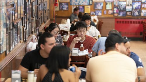 FILE - Customers have lunch at Katz's Delicatessen on Sept. 30, 2020 in New York. In a recent column, New York Times restaurant critic Pete Wells announced he's leaving the beat because the constant eating has led to obesity and other health problems. (AP Photo/Mary Altaffer, File)