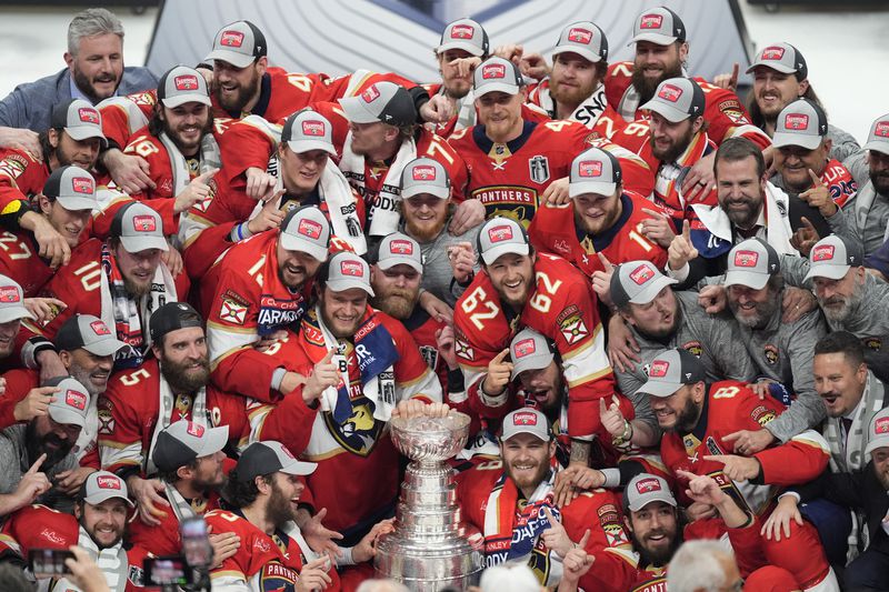 The Florida Panthers pose with the NHL hockey Stanley Cup trophy after defeating the Edmonton Oilers in Game 7 of the Final, Monday, June 24, 2024, in Sunrise, Fla. (AP Photo/Rebecca Blackwell)