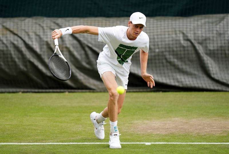 Italy's Jannik Sinner plays a shot on the practice court at the All England Lawn Tennis and Croquet Club ahead of the Wimbledon Championships, which begins on July 1st, in London, Friday June 28, 2024. (Zac Goodwin/PA via AP)