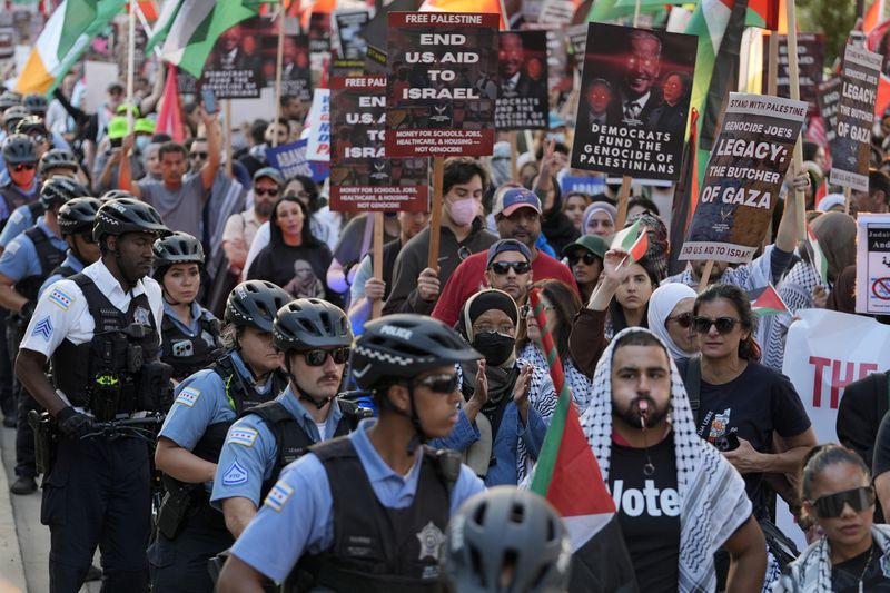 Protesters march during a demonstration outside the Democratic National Convention Wednesday, Aug. 21, 2024, in Chicago. (AP Photo/Frank Franklin II)