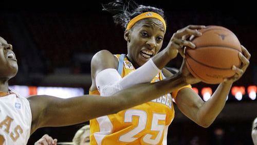 Tennessee's Glory Johnson (25) grabs a rebound over Texas' Ashley Gayle, left, during the second half of an NCAA women's basketball game, Sunday, Dec. 12, 2010 in Austin, Texas. Tennessee won 92-77.