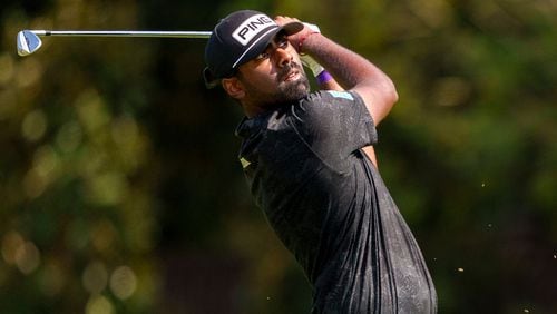 Sahith Theegala hits his second shot from the fairway on hole number seven during the third round of the Tour Championship golf tournament, Saturday, Aug. 31, 2024, in Atlanta. (AP Photo/Jason Allen)