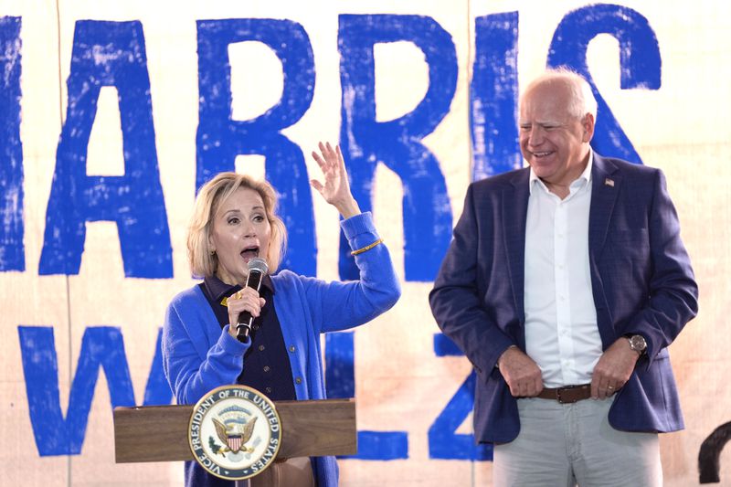 Minnesota first lady Gwen Walz will visit Georgia this week. She is pictured with her husband, Minnesota Gov. Tim Walz, the Democratic vice presidential nominee. 