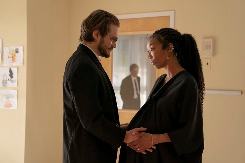 This image released by A24 shows Andrew Burnap, left, and Brandy Norwood in a scene from "The Front Room." (A24 via AP)