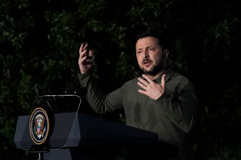 Ukraine's President Volodymyr Zelenskyy talks to journalists during a news conference after signing a bilateral security agreement with U.S. President Joe Biden during the sidelines of the G7 summit at Savelletri, Italy, Thursday, June 13, 2024. (AP Photo/Andrew Medichini)
